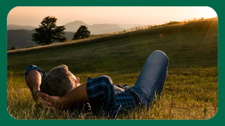 Man relaxing in nature, experiencing the best smelling men’s body wash Man relaxing in nature, experiencing the best smelling men’s body wash